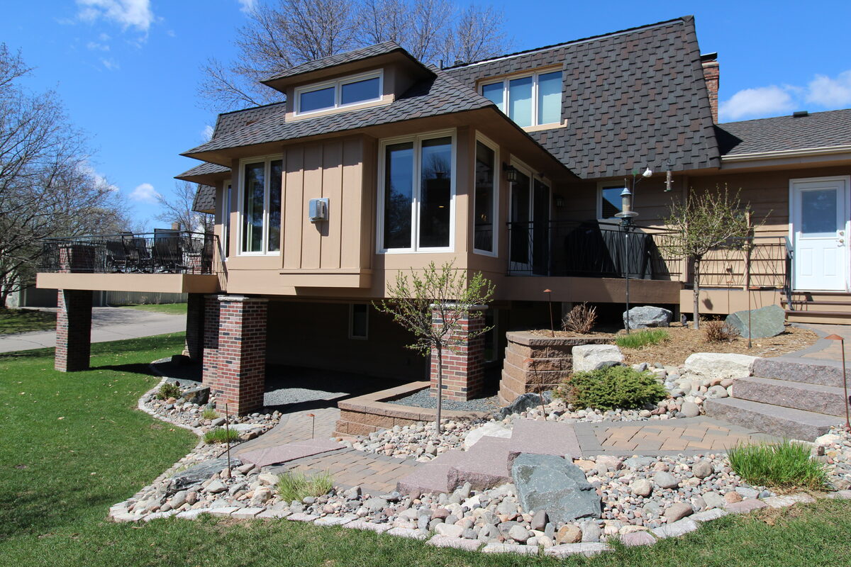 Exterior of a home addition with deck above