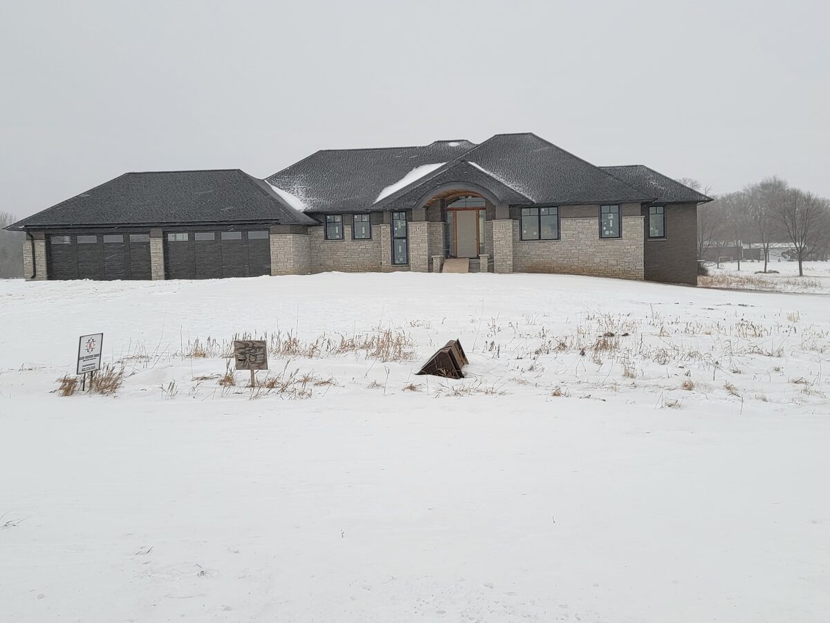 East Metro prairie custom home exterior in winter
