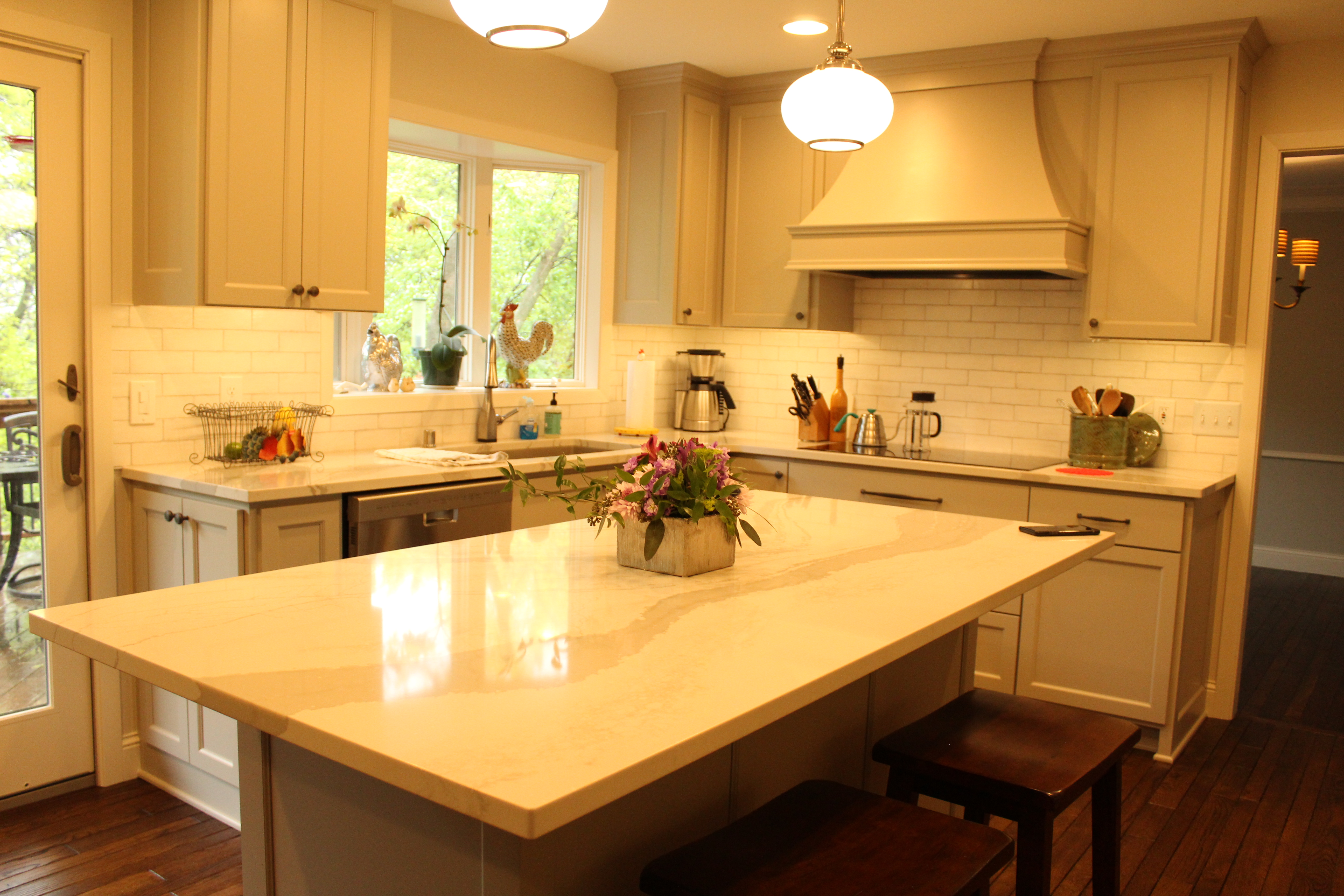 Appliance wall featuring built-in double ovens and a French-door refrigerator integrated into custom cabinetry.