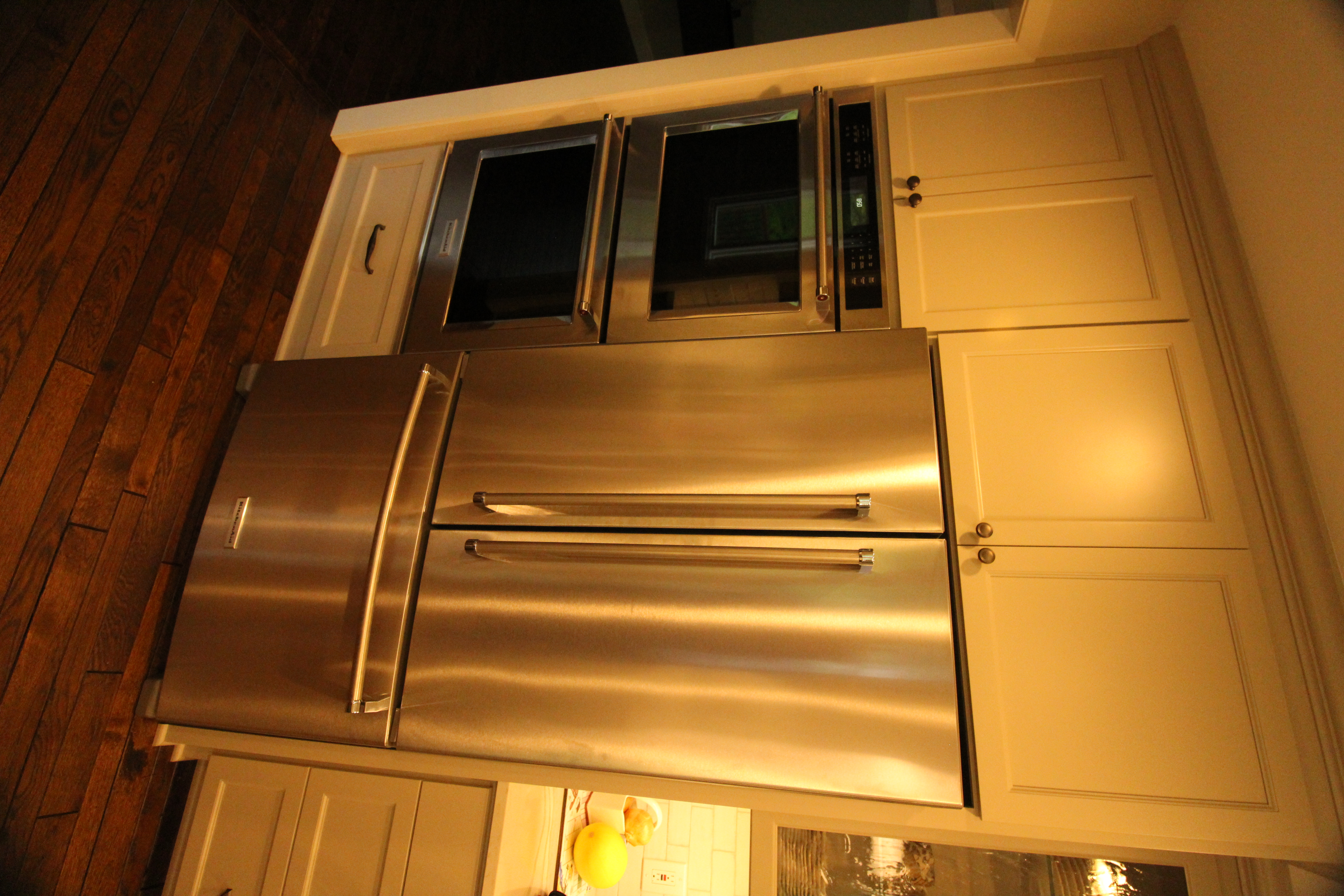 Wide kitchen view from the entry with the island centered, highlighting an open-concept layout designed for gatherings.