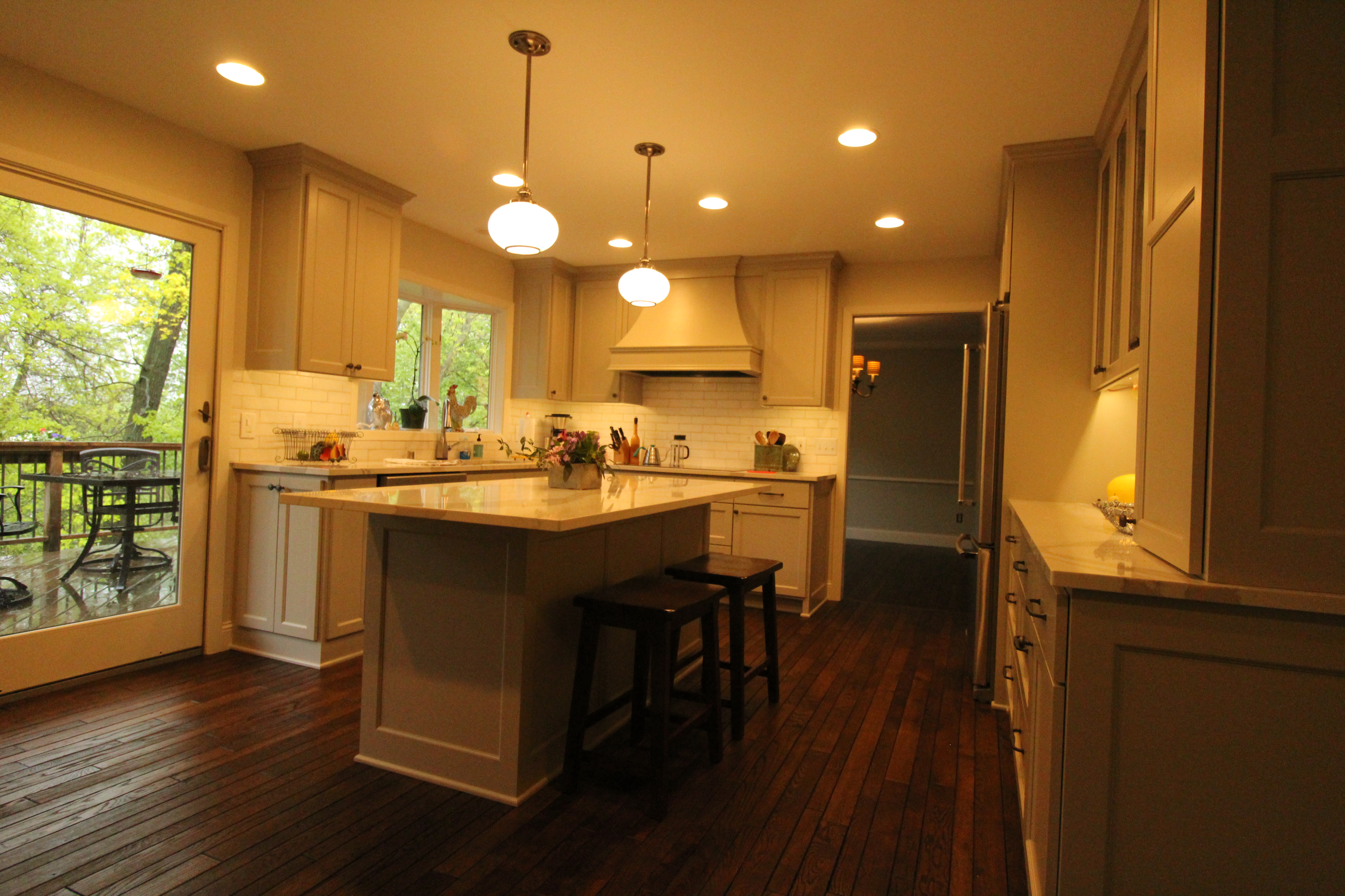 Additional wide view of the open-concept kitchen showcasing the island, cabinetry, and cohesive finish palette.