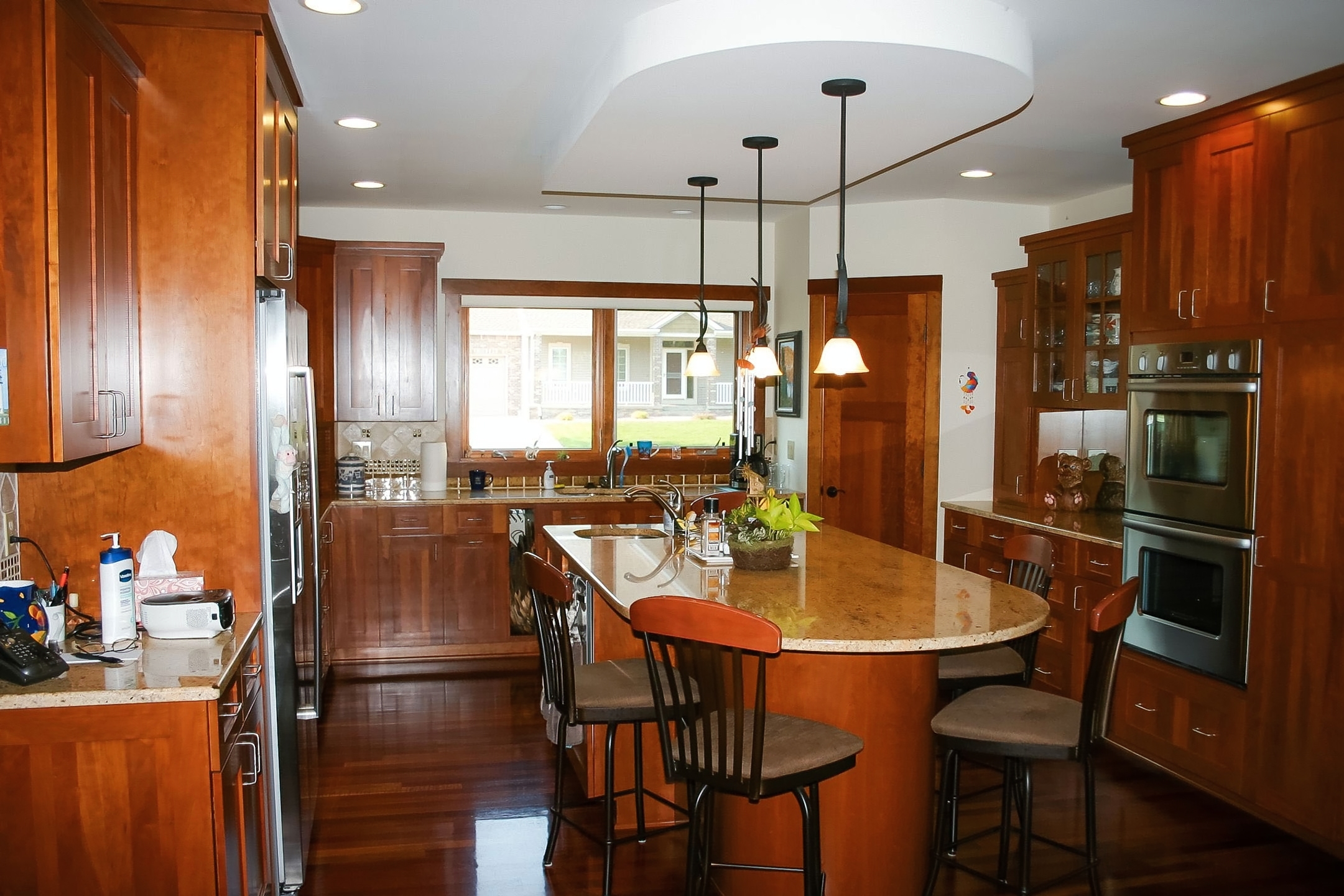 Custom cedar sauna with bench seating and a wood door featuring a glass panel.