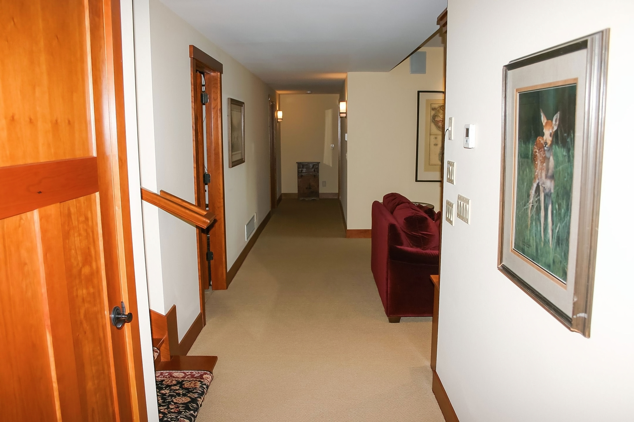 Stone fireplace wall with wood mantel—natural materials creating a timeless focal point.